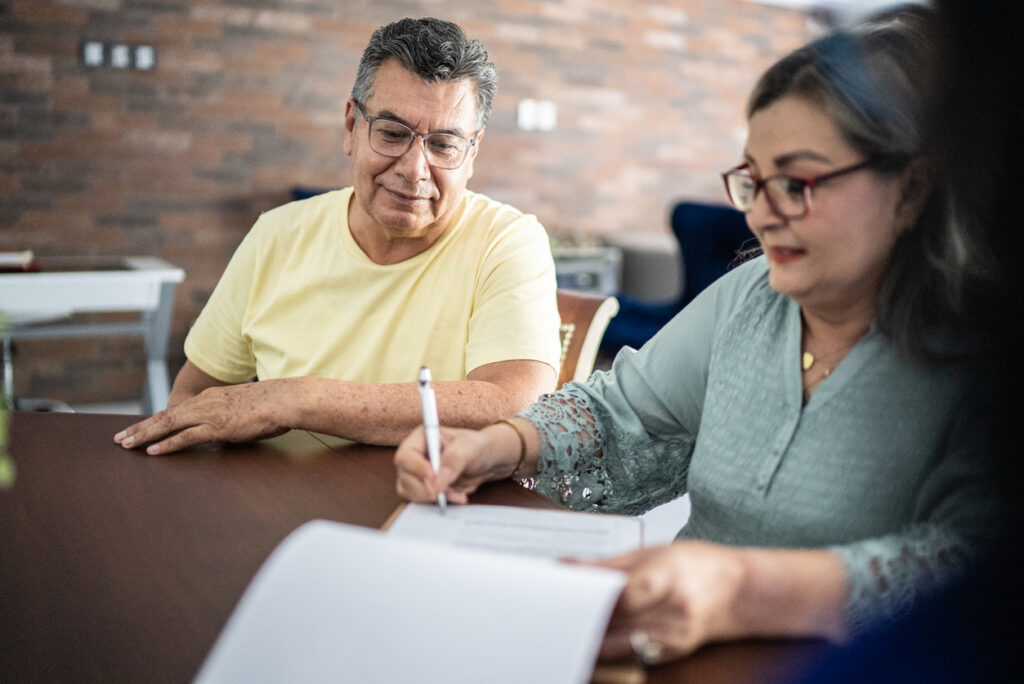 Adults reviewing Will and estate planning documents in NSW