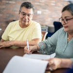 Adults reviewing Will and estate planning documents in NSW
