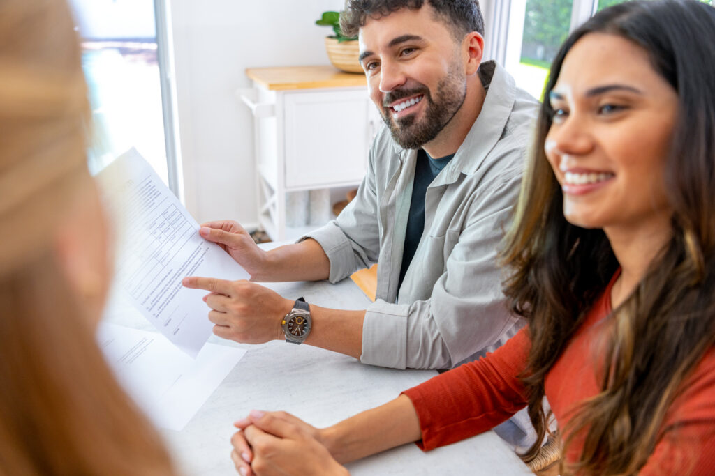 Home buyers discussing conveyancing timeline with lawyer in NSW