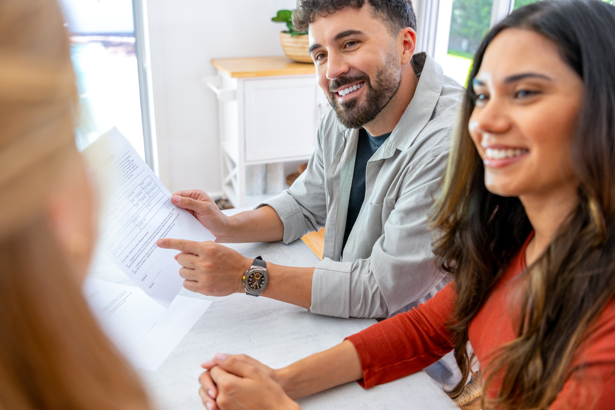 Home buyers discussing conveyancing timeline with lawyer in NSW