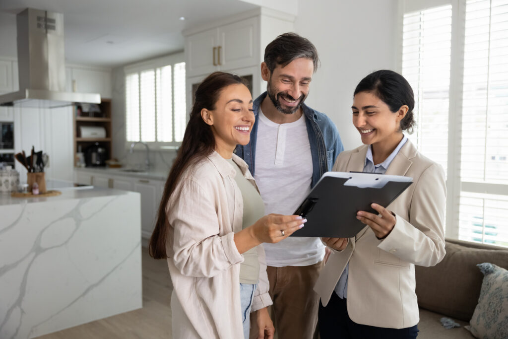 First home buyers reviewing contract with conveyancing lawyer in NSW