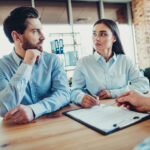 Business owners meeting with family lawyer to protect assets during divorce