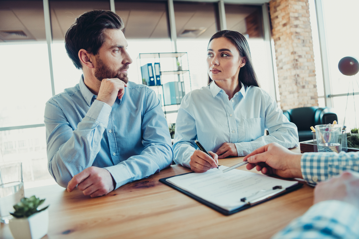 Business owners meeting with family lawyer to protect assets during divorce