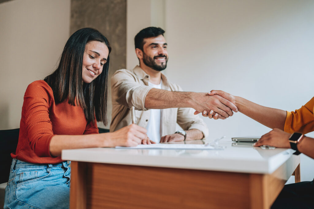 First-home buyers in Parramatta reviewing a property contract with a lawyer