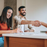 First-home buyers in Parramatta reviewing a property contract with a lawyer