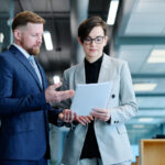 Business owner reviewing a commercial lease agreement in a modern office setting