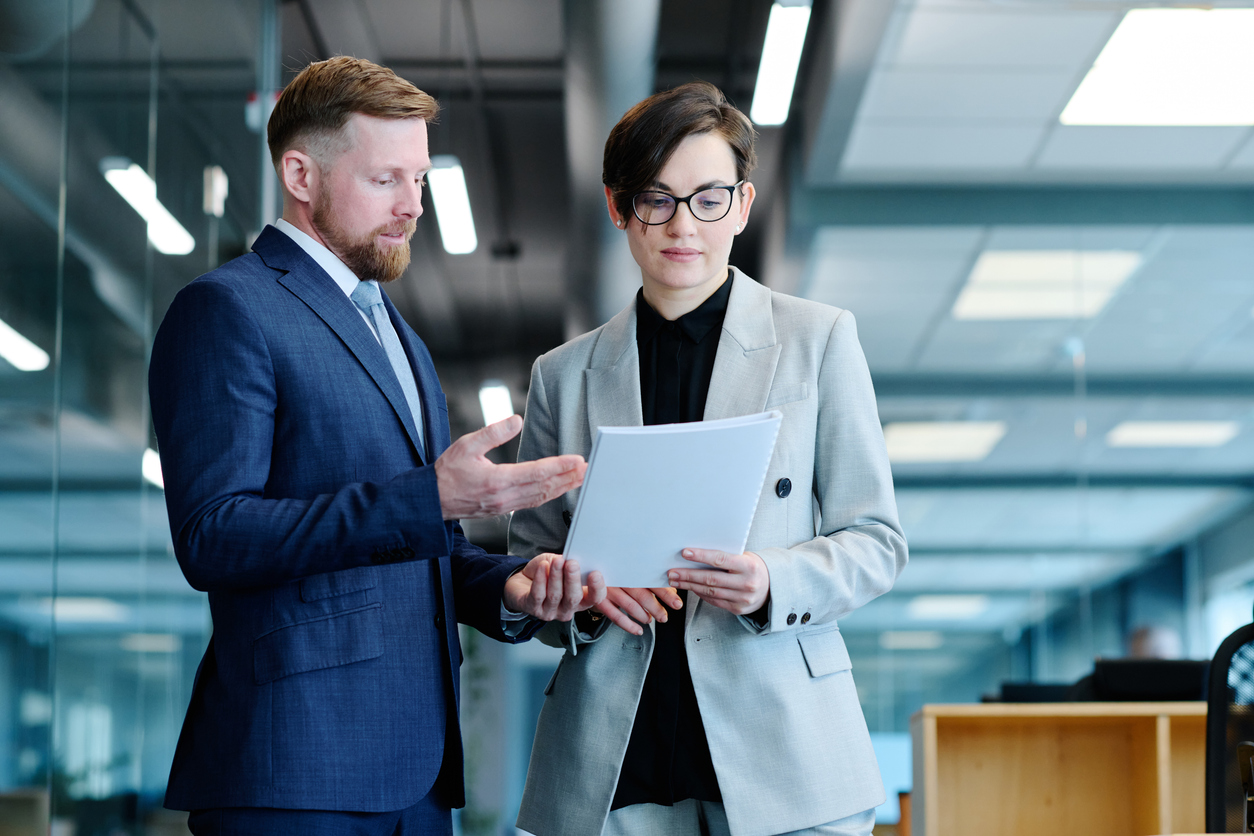 Business owner reviewing a commercial lease agreement in a modern office setting