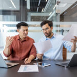 Business partners meeting with a commercial lawyer to resolve a partnership dispute in NSW.