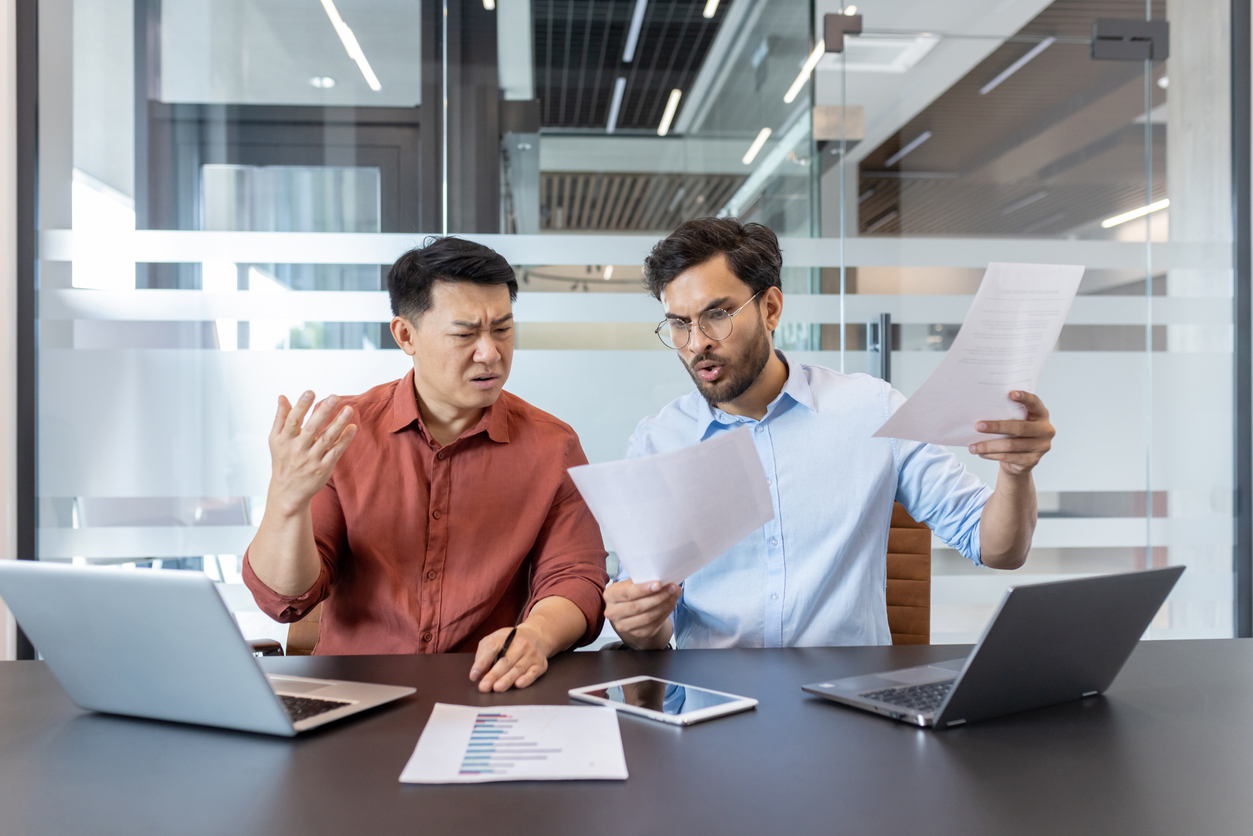 Business partners meeting with a commercial lawyer to resolve a partnership dispute in NSW.