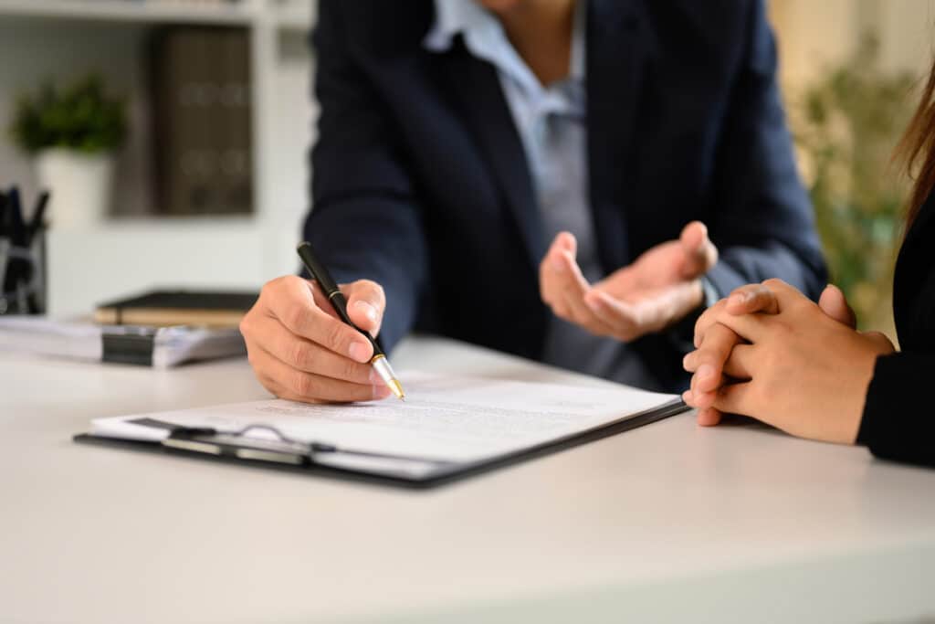 Property lawyer explaining a strata inspection report to a buyer in Parramatta NSW
